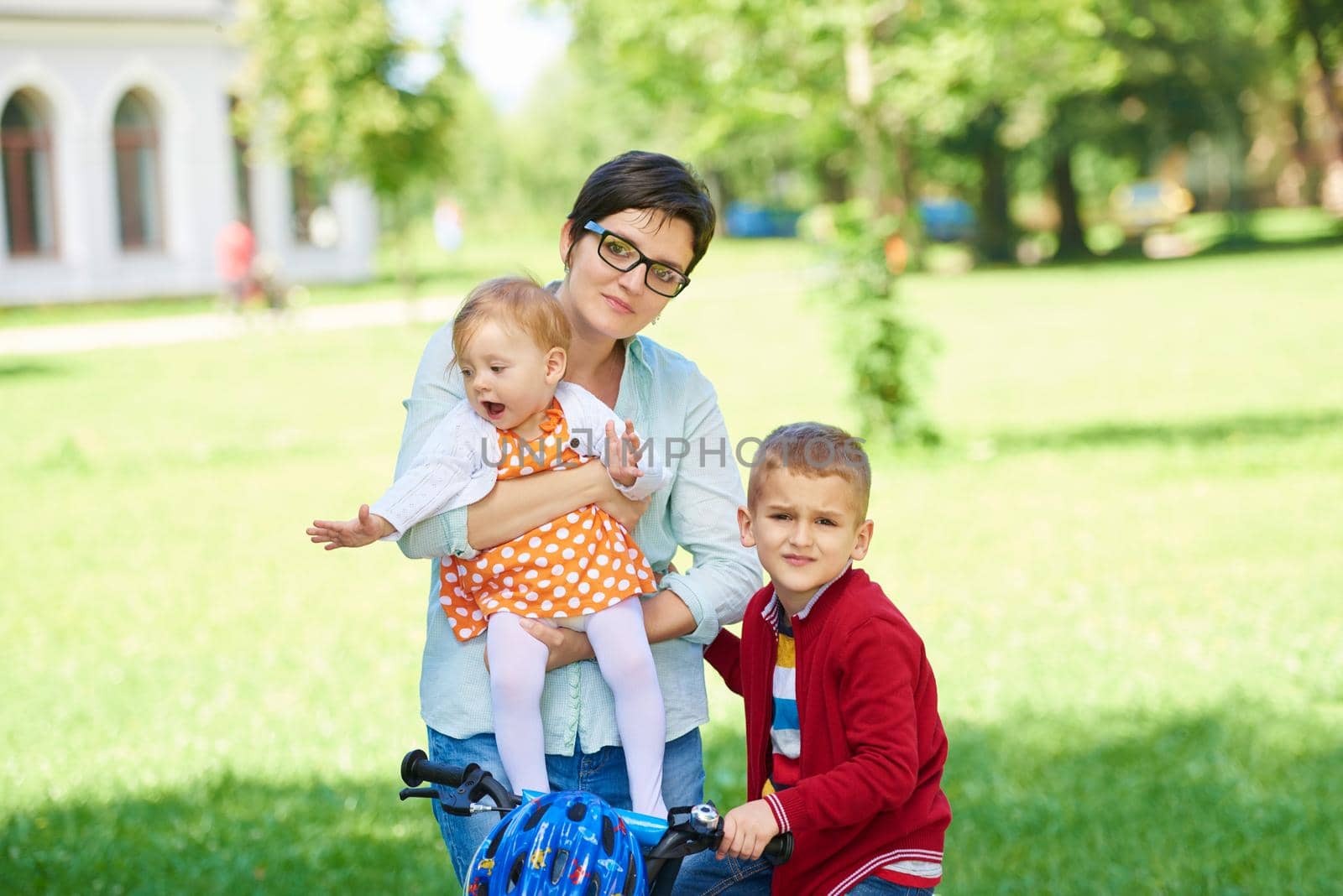 happy young family in park by dotshock