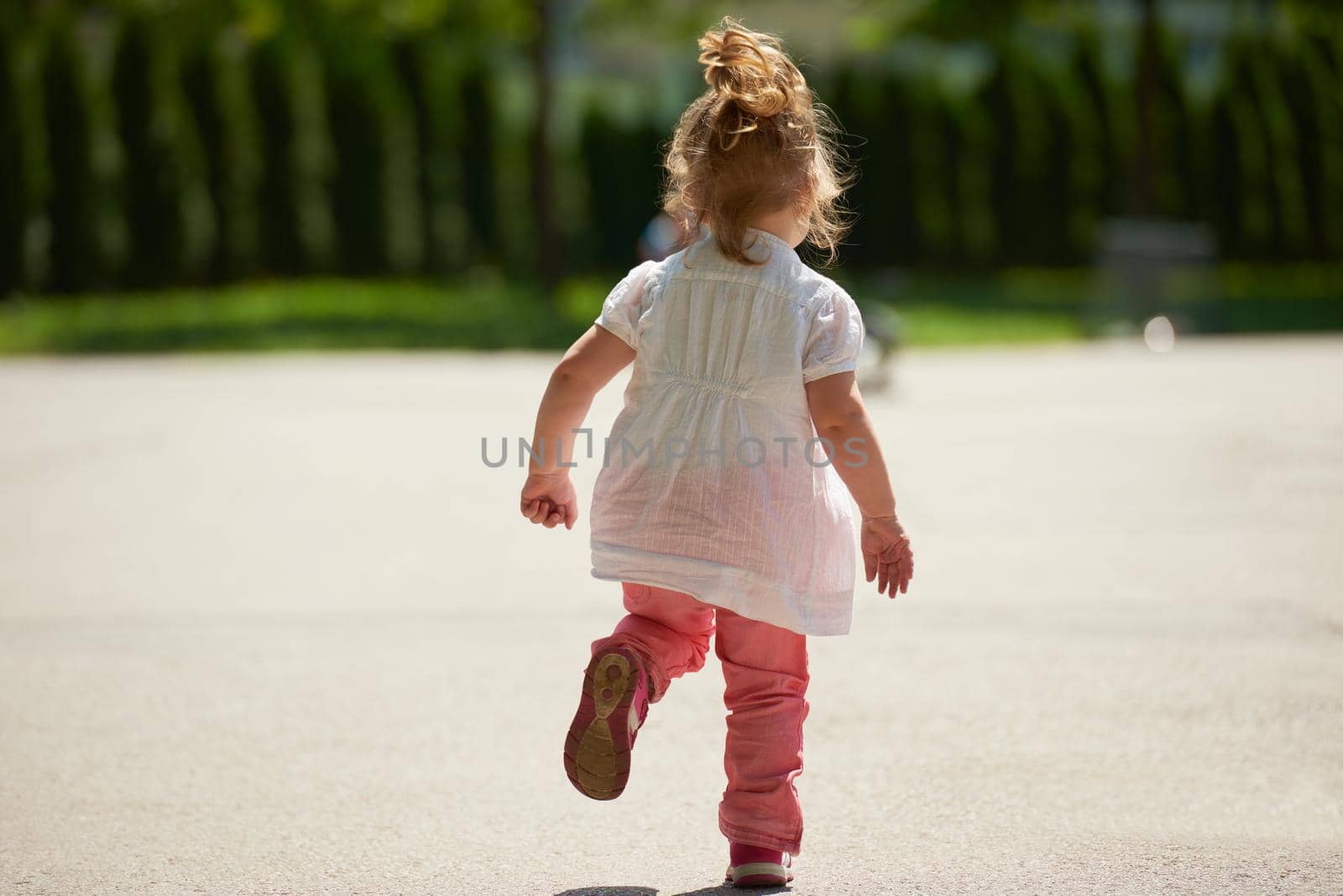 happy  little girl have fun in park