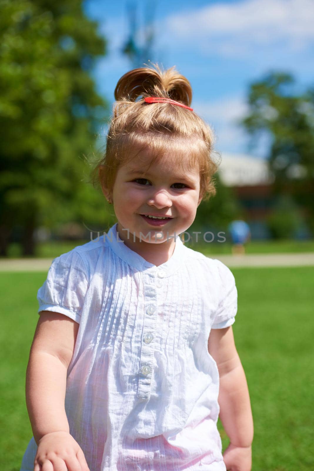 happy  little girl have fun in park