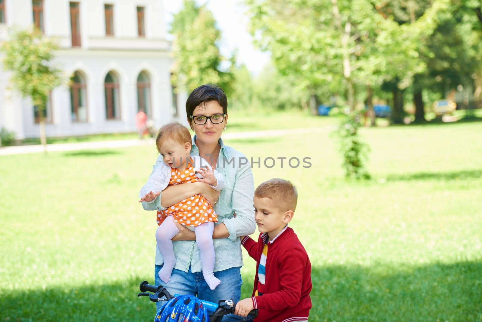 happy young family in park by dotshock