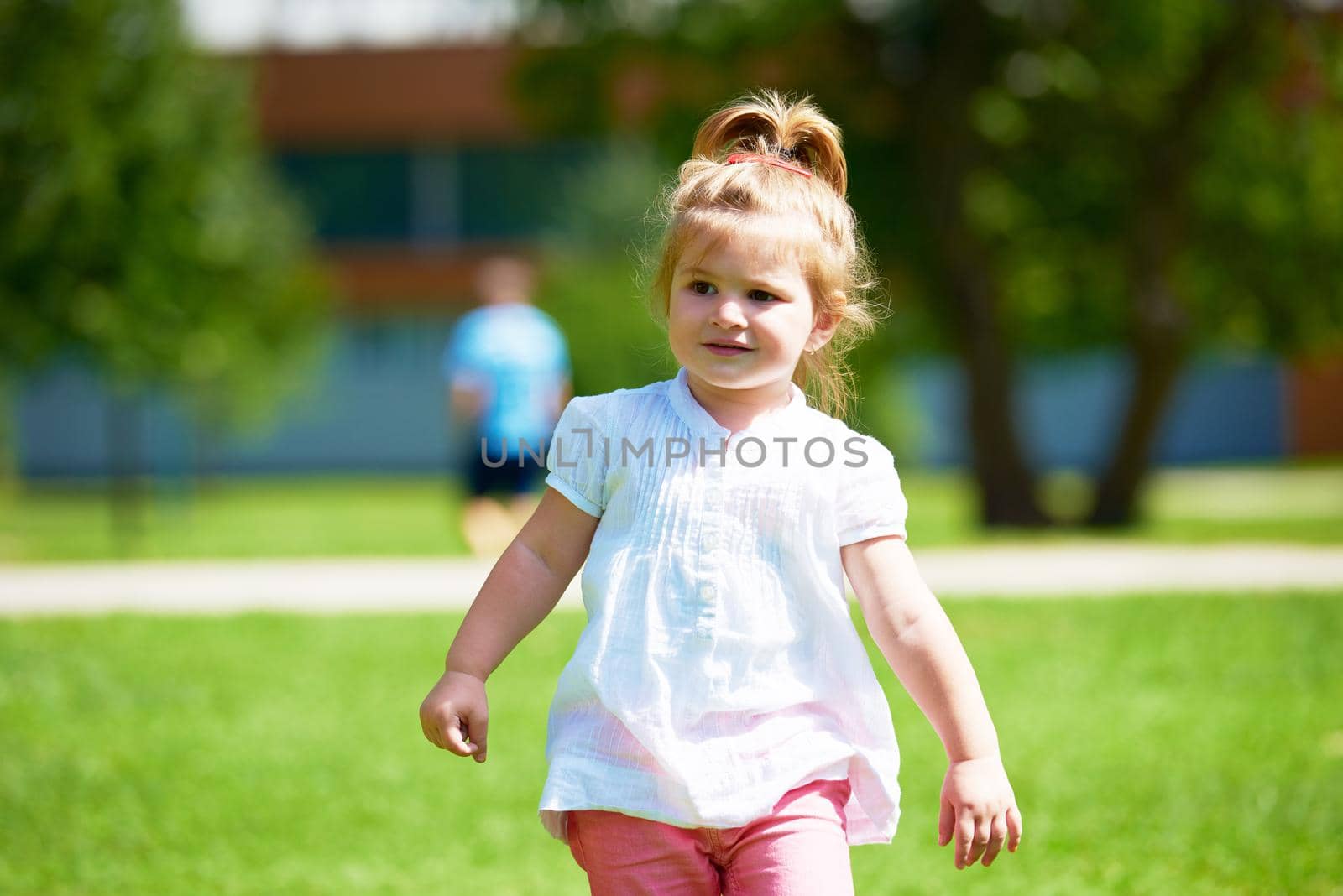 happy  little girl have fun in park