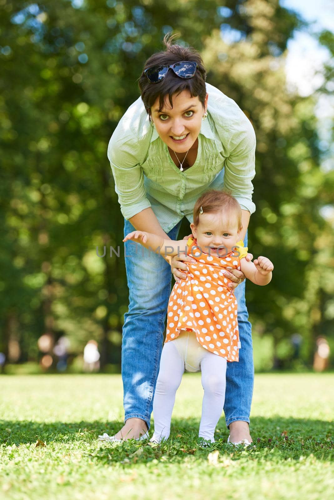 mother and baby in park by dotshock