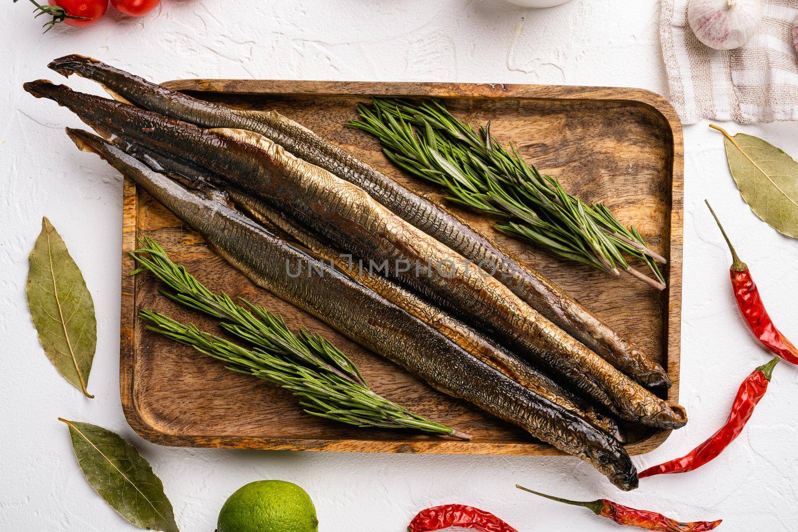 Smoked lamprey set, on white stone table background, top view flat lay