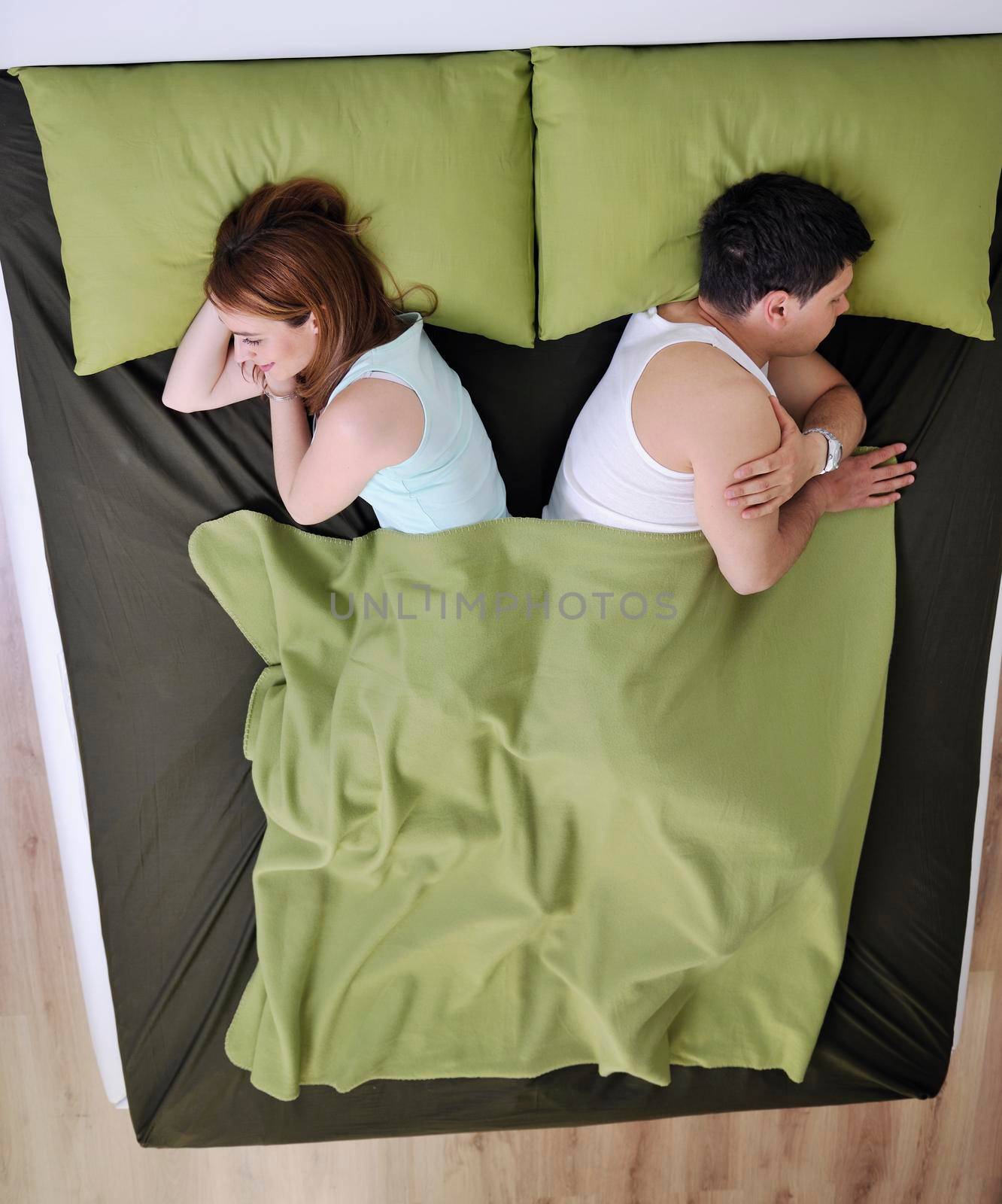 happy young couple in bed at morning