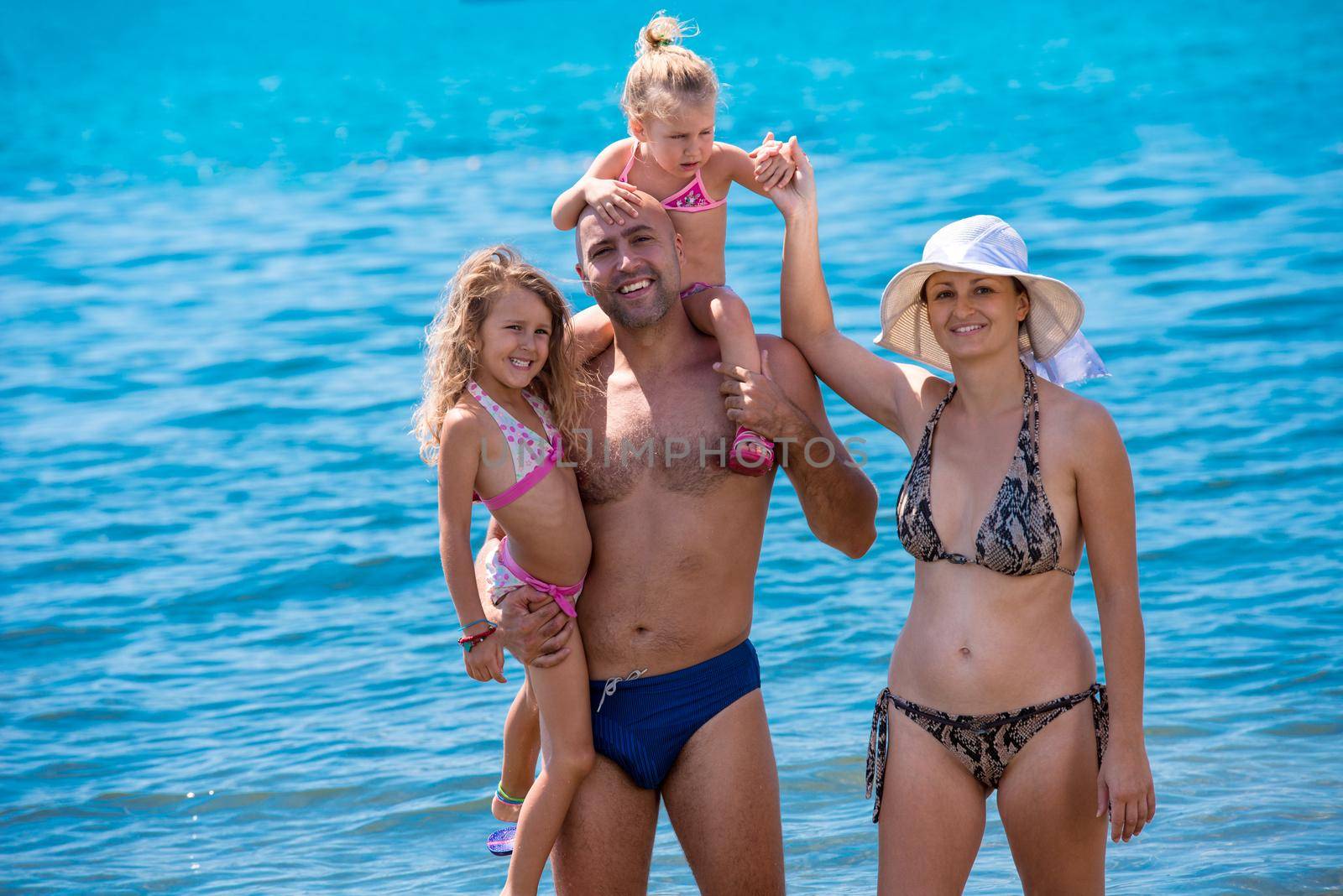 portrait of happy family with kids during summer vacation by dotshock