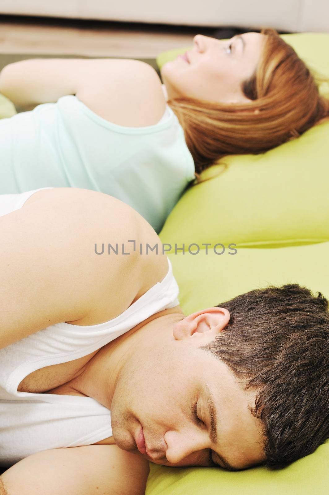 happy young couple in bed at morning