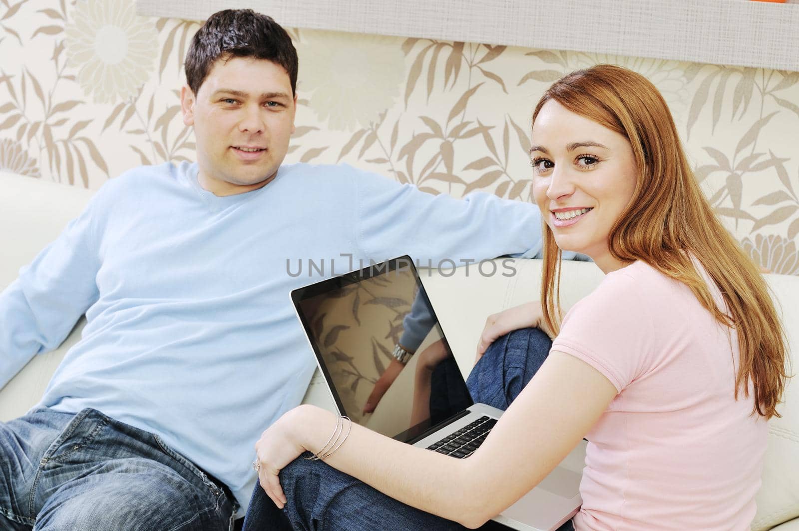 young couple at home with  modern livingroom indoor working on laptop on house finance and planing