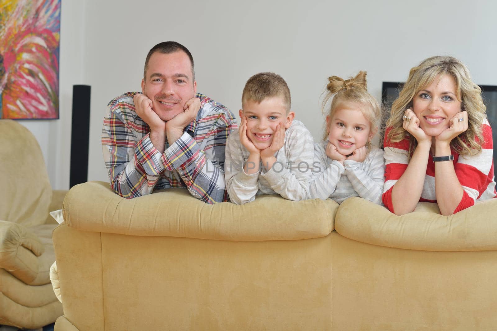 hapy young family have fun  with their children at modern living room home indoors