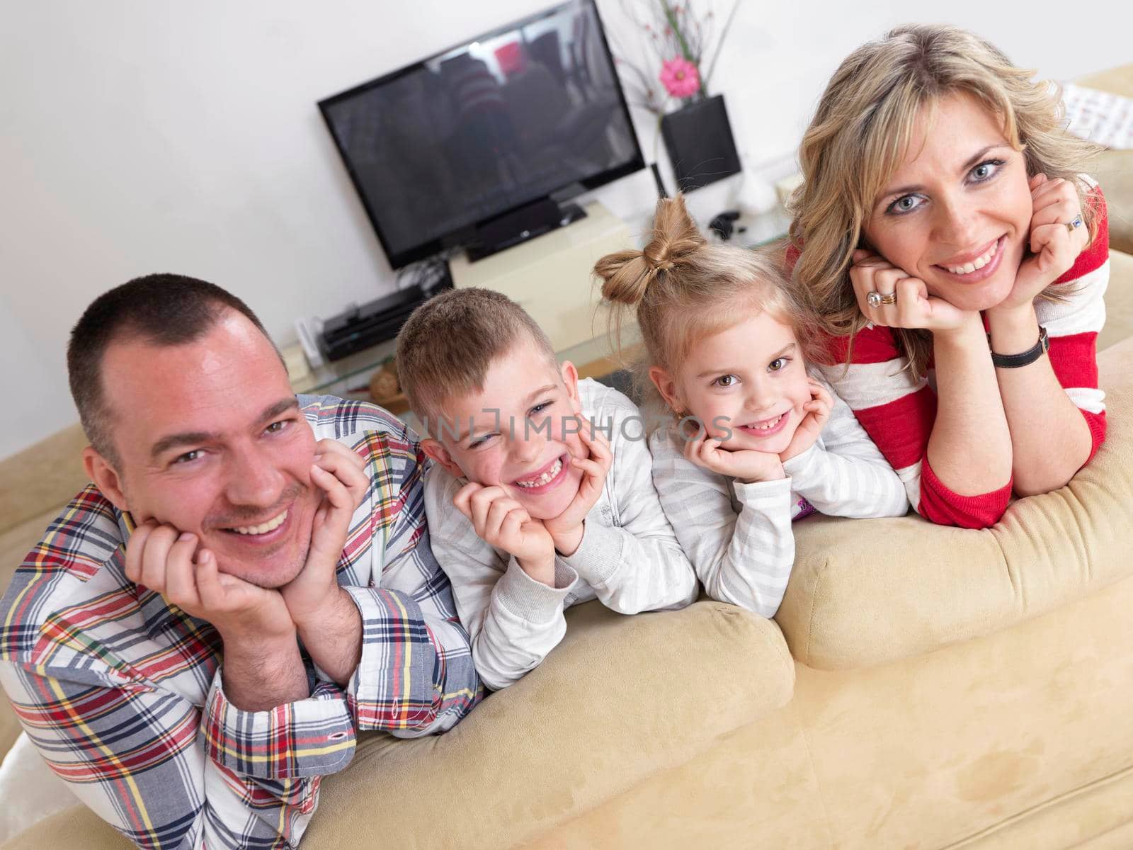 hapy young family have fun  with their children at modern living room home indoors