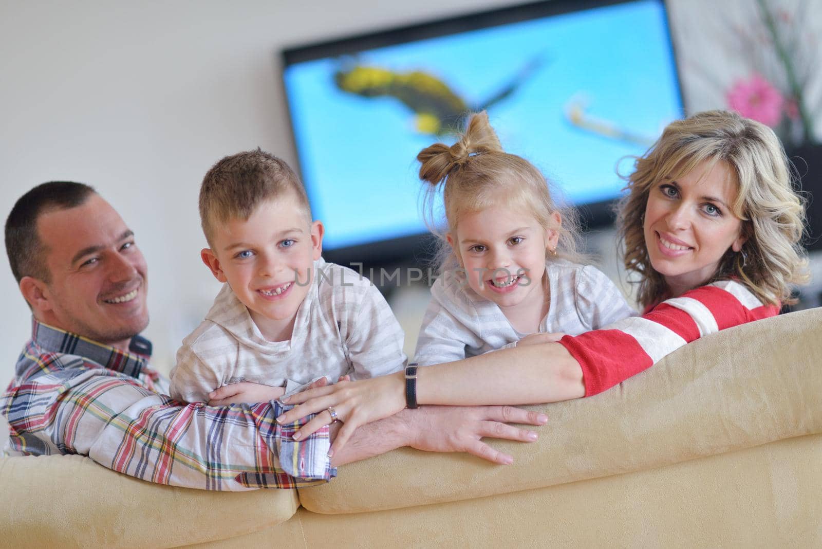 hapy young family have fun  with their children at modern living room home indoors