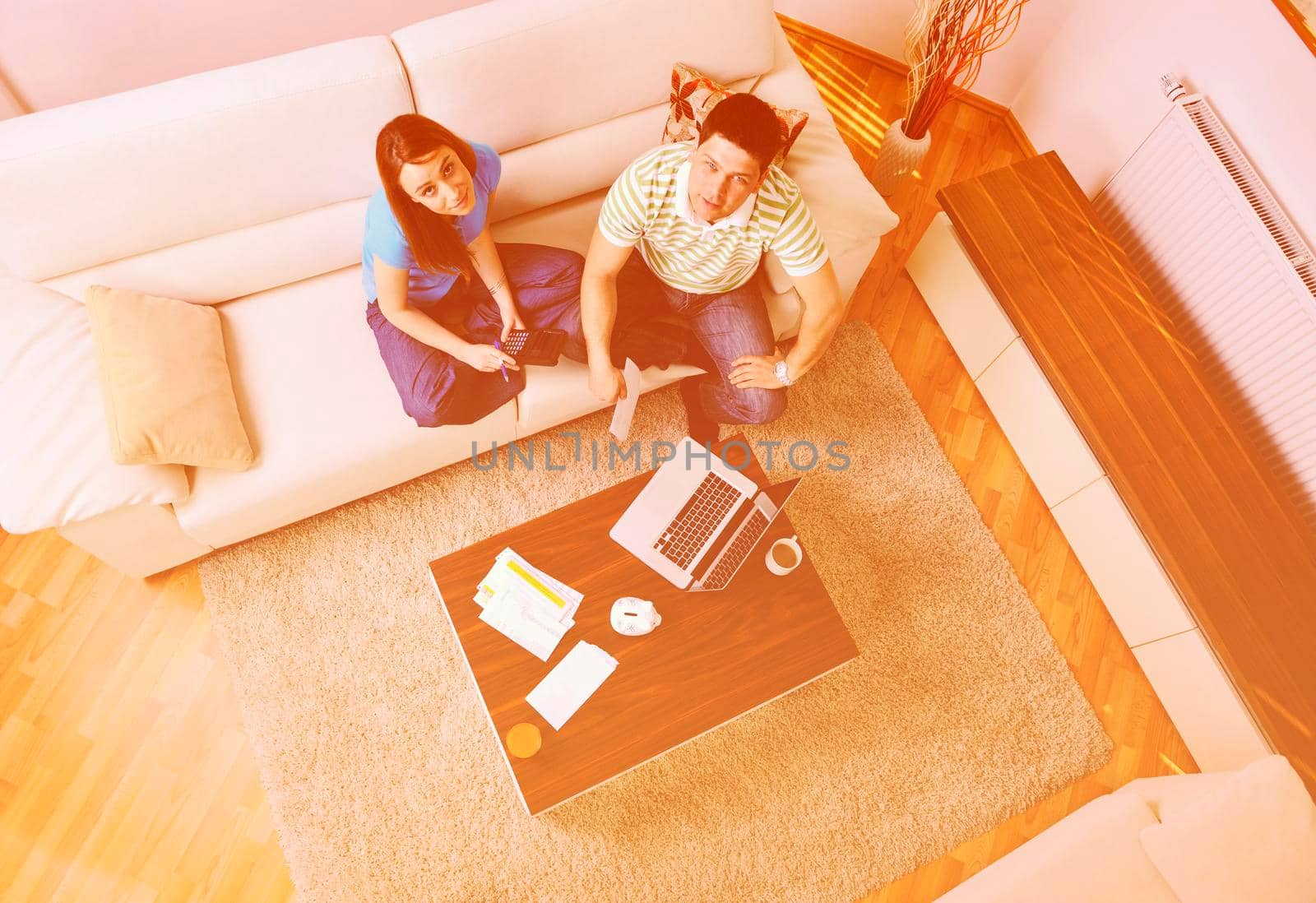 young couple at home with  modern livingroom indoor working on laptop on house finance and planing