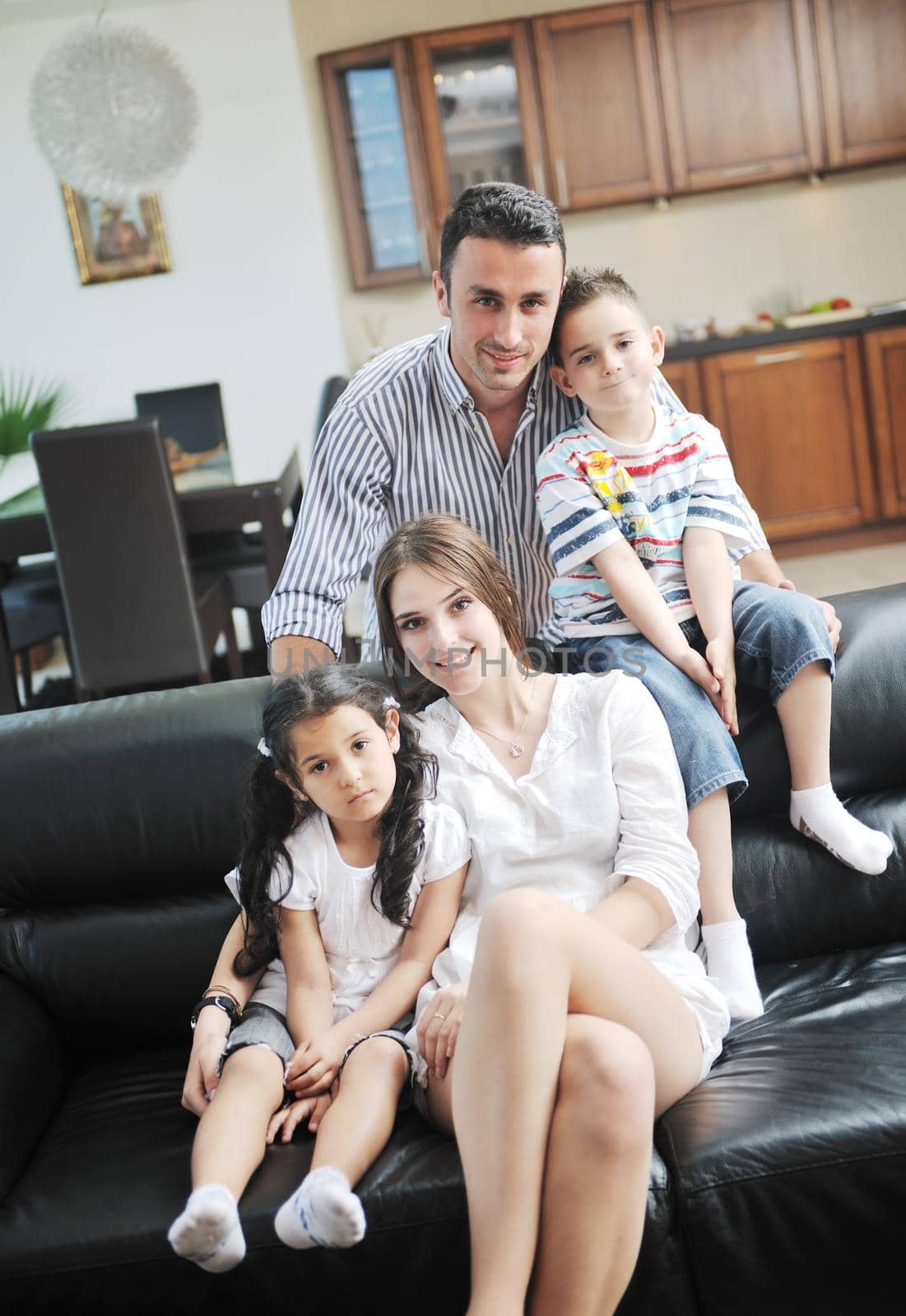 happy young family relax and have fun at modern home indooor