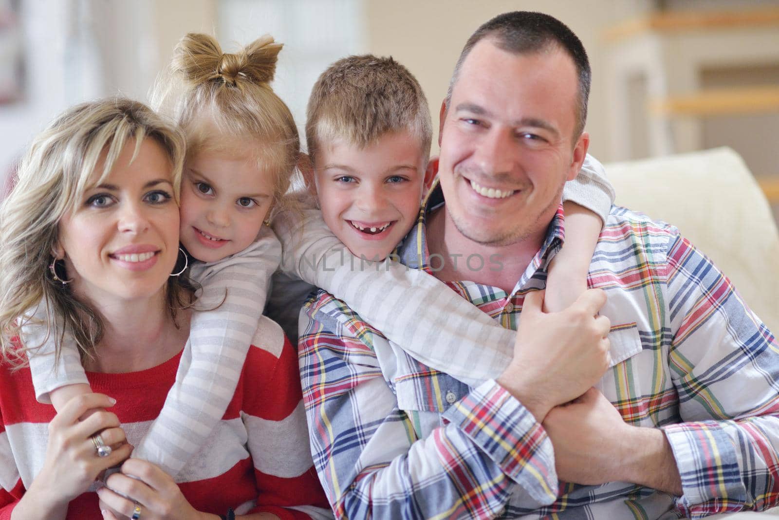 hapy young family have fun  with their children at modern living room home indoors