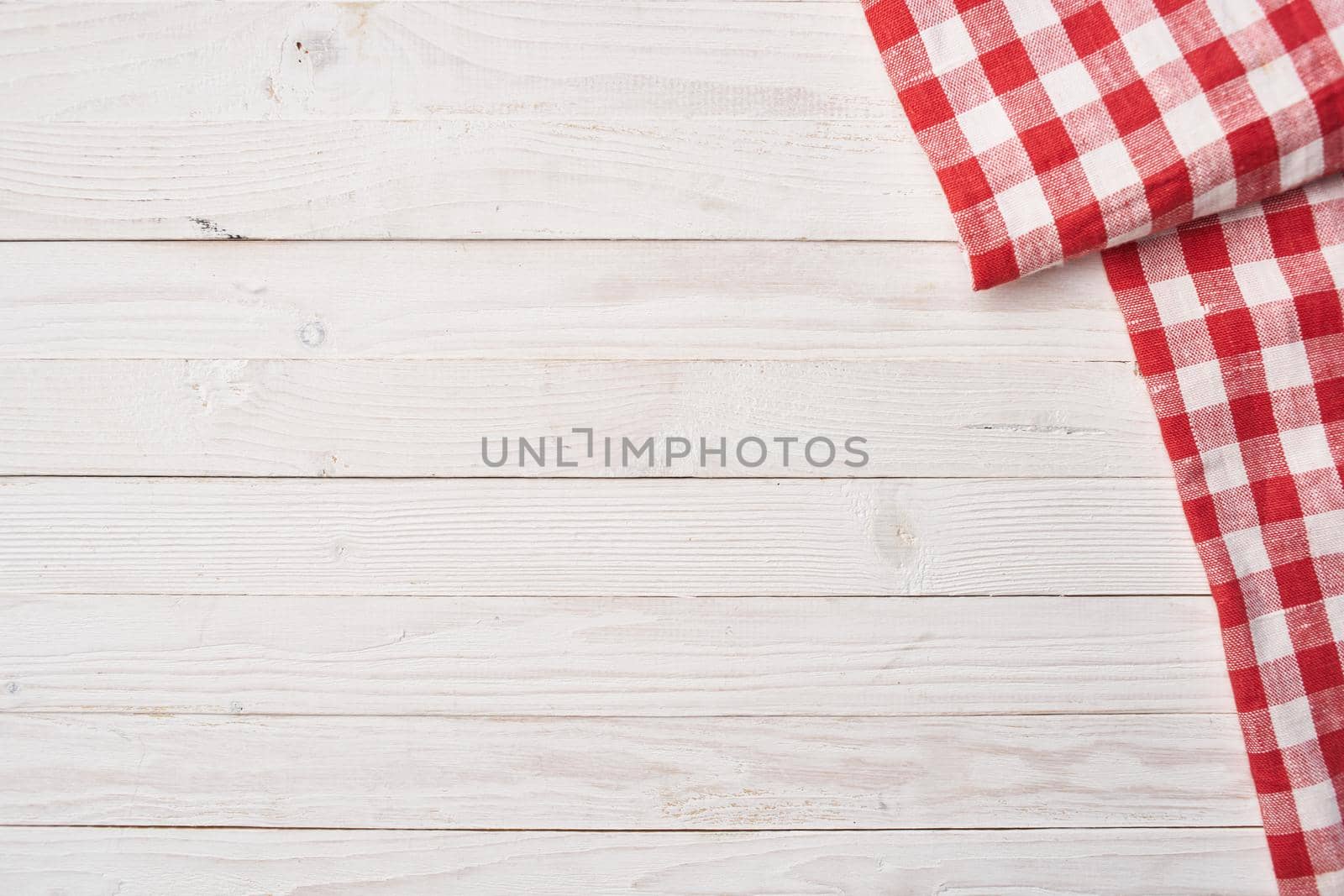 Red checkered tablecloth wooden background texture kitchen decoration by Vichizh