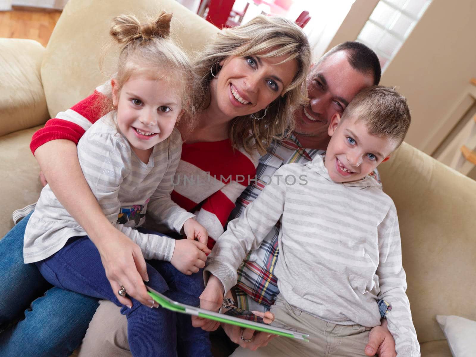 hapy young family have fun  with their children at modern living room home indoors