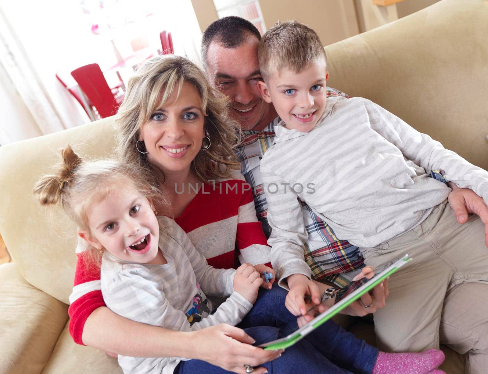 hapy young family have fun  with their children at modern living room home indoors