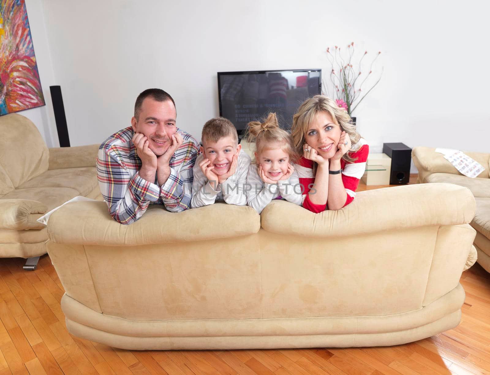 hapy young family have fun  with their children at modern living room home indoors