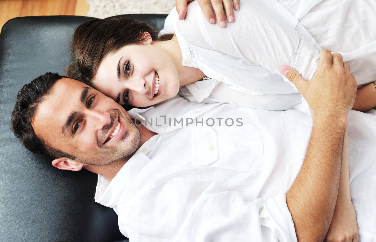 happy young couple relax at modern home livingroom indoor