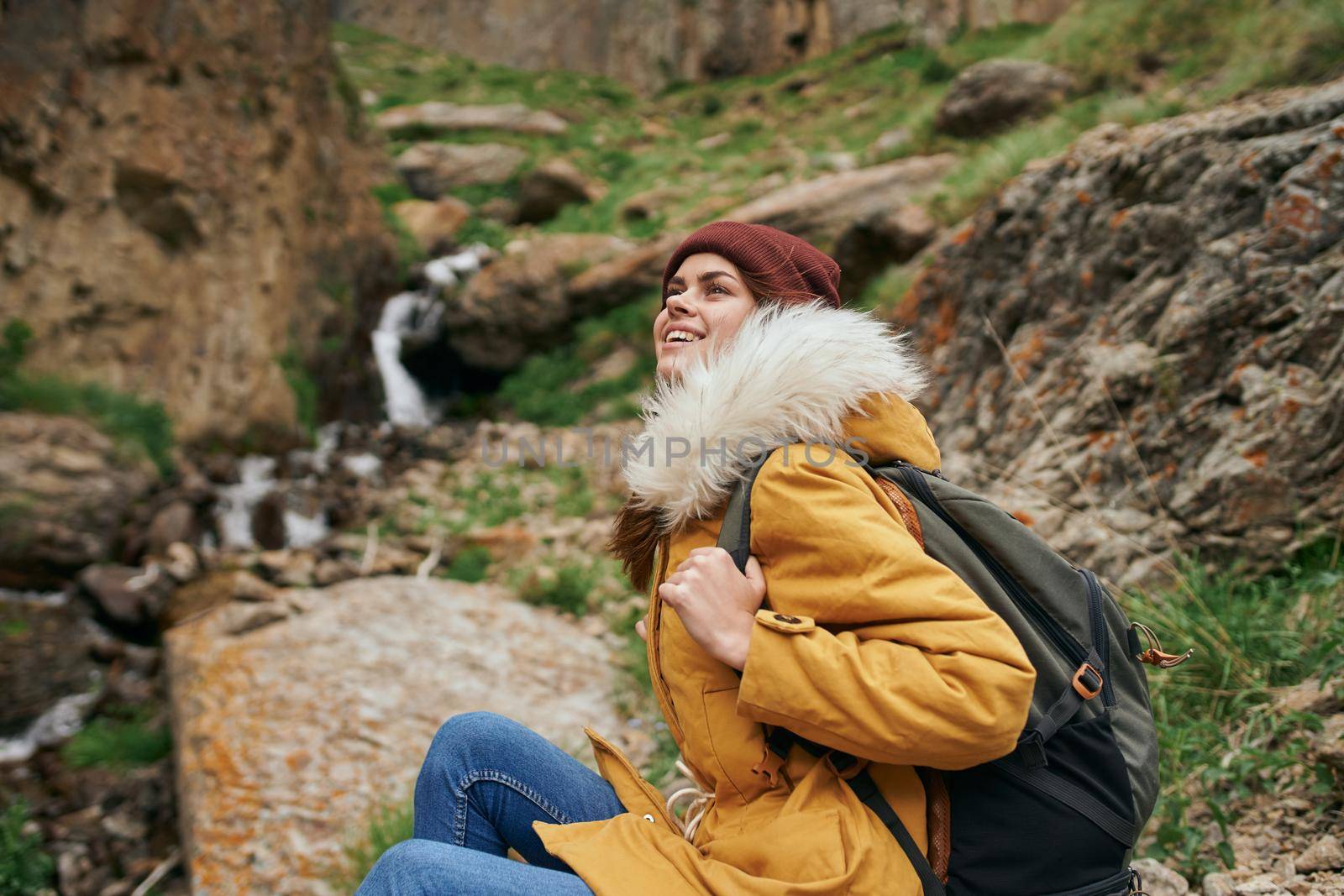 woman hiker with backpack mountains travel adventure freedom. High quality photo