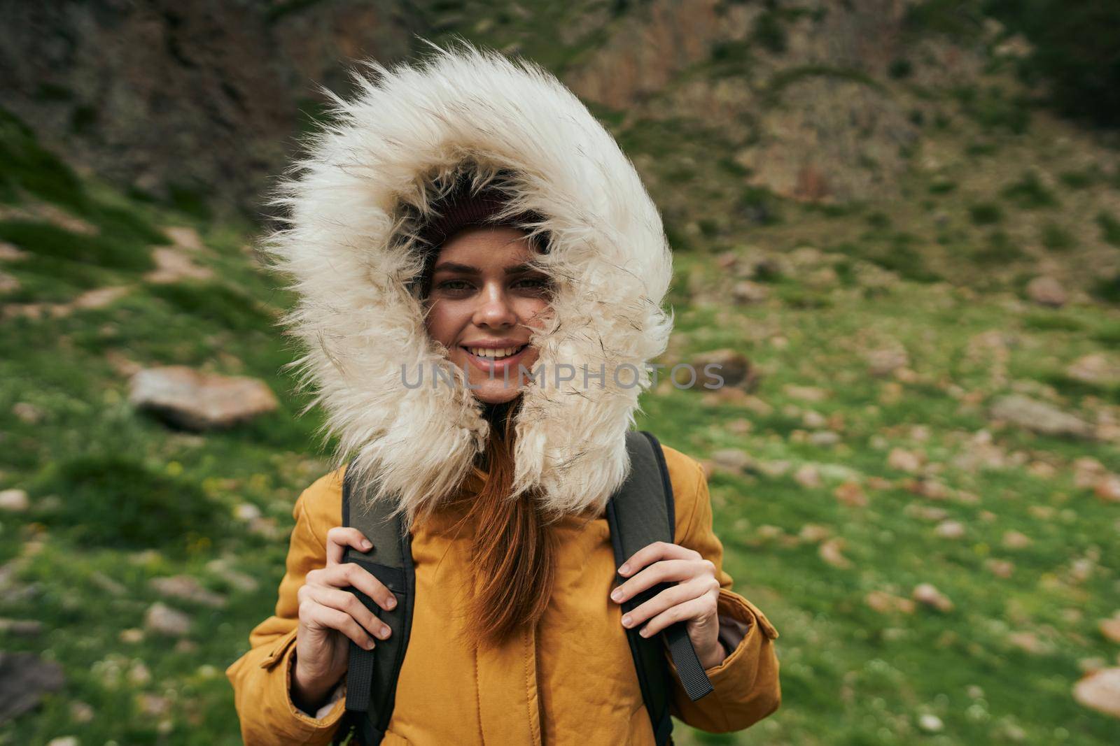 woman hiker with backpack mountains travel adventure freedom. High quality photo