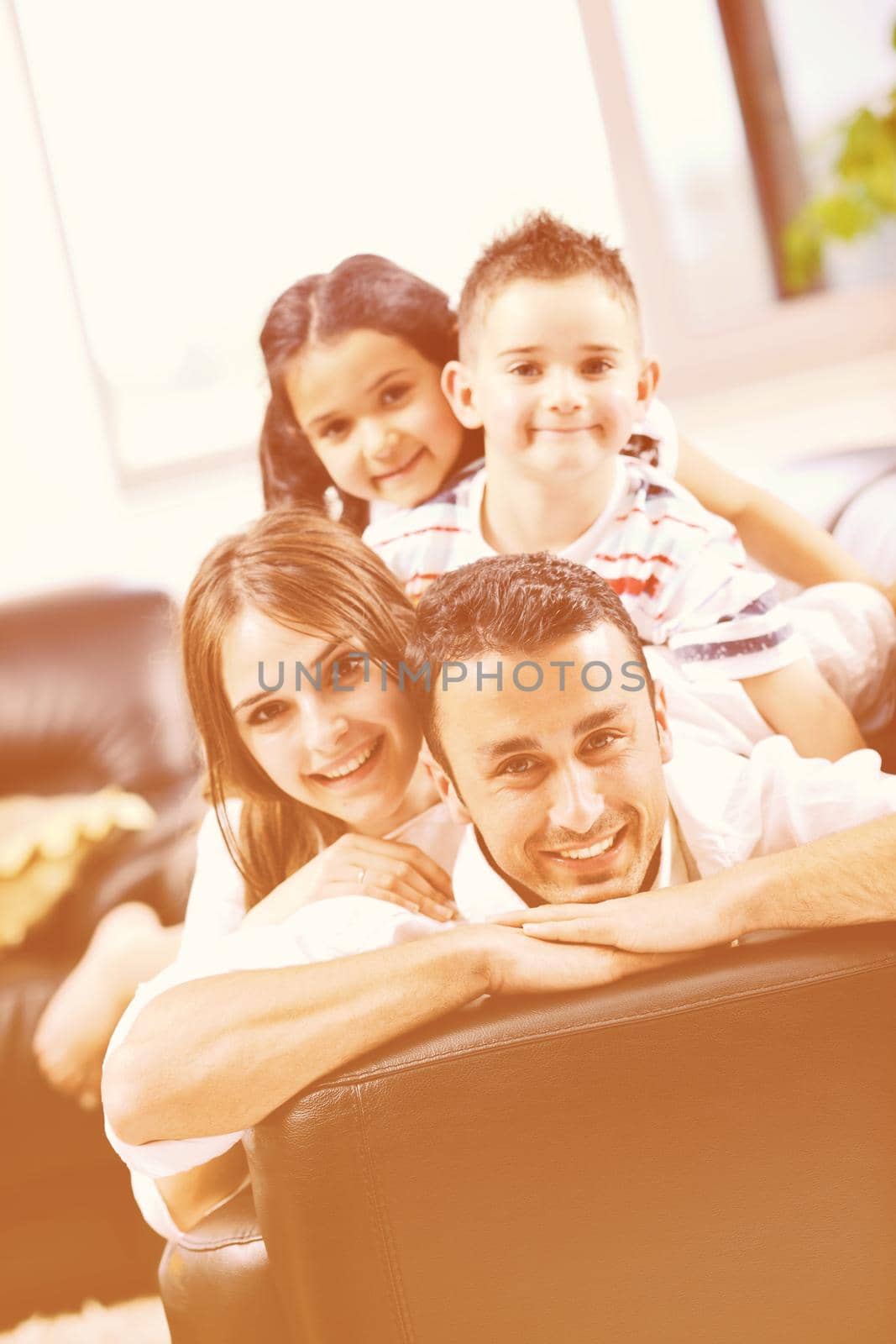 happy young family relax and have fun at modern home indooor