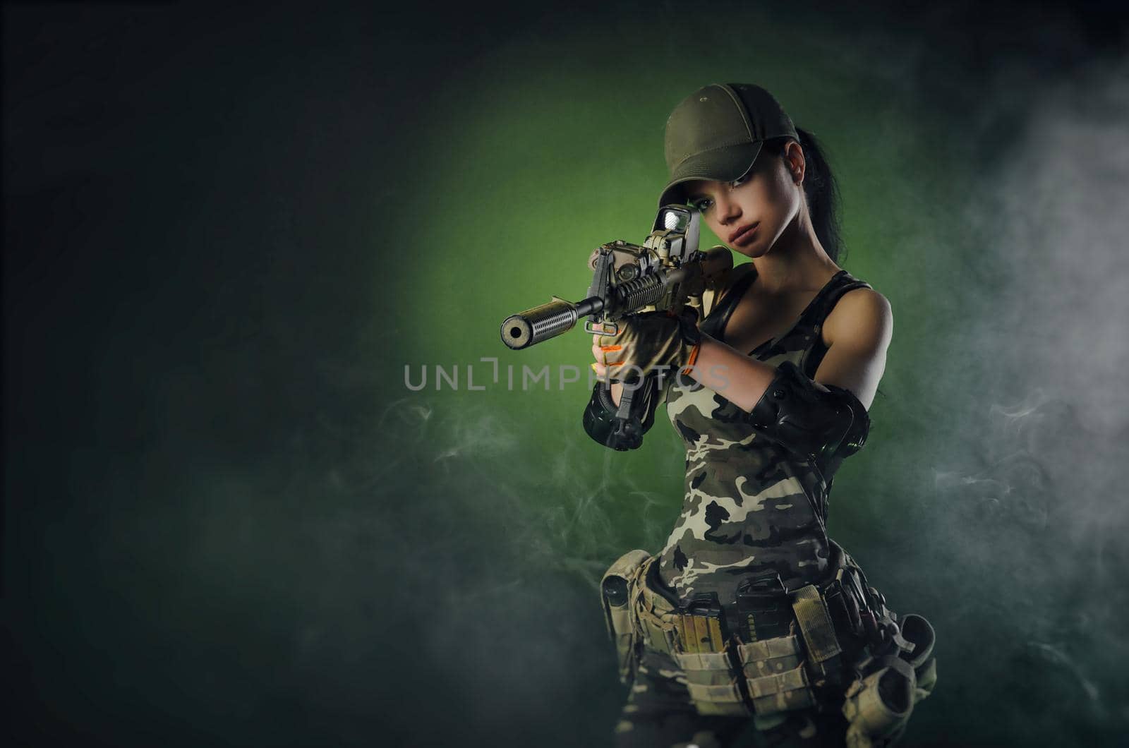 a soldier girl poses with an automatic rifle by Rotozey