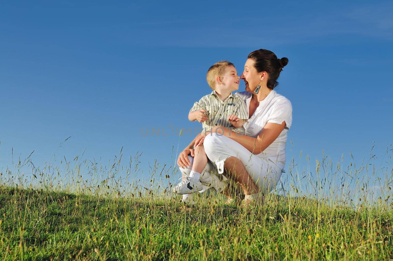 happy young woman mother play and outdoor with beautiful child 