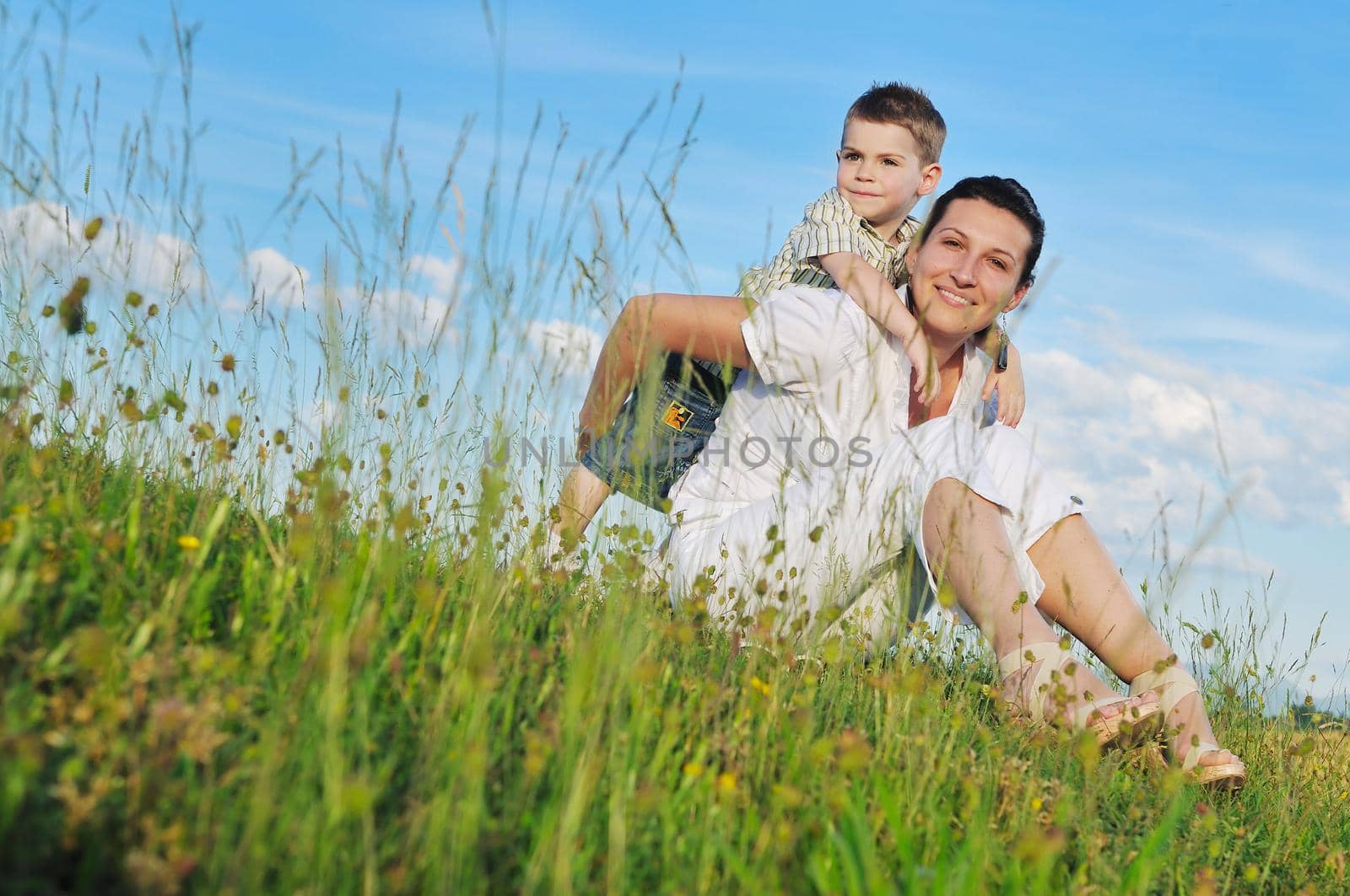 happy young woman mother play and outdoor with beautiful child 