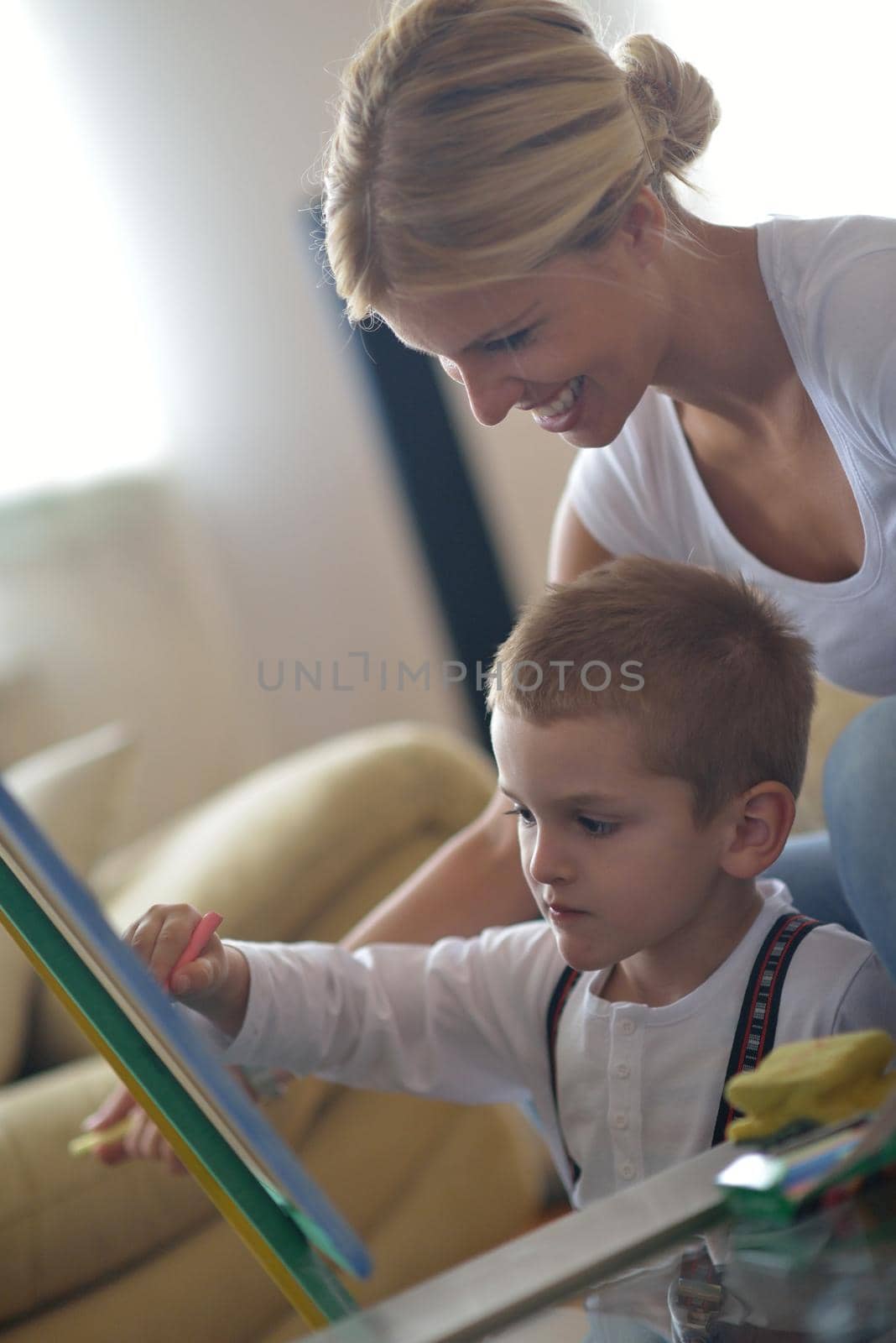 family drawing on school board at home by dotshock