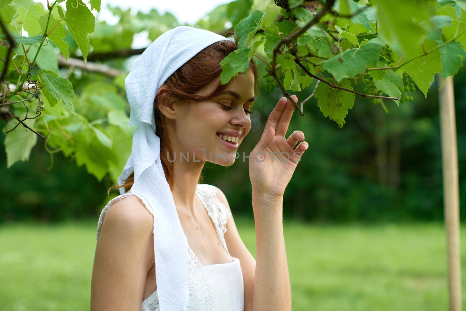 woman with white headband countryside nature garden agriculture. High quality photo