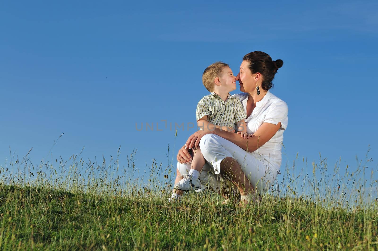 happy young woman mother play and outdoor with beautiful child