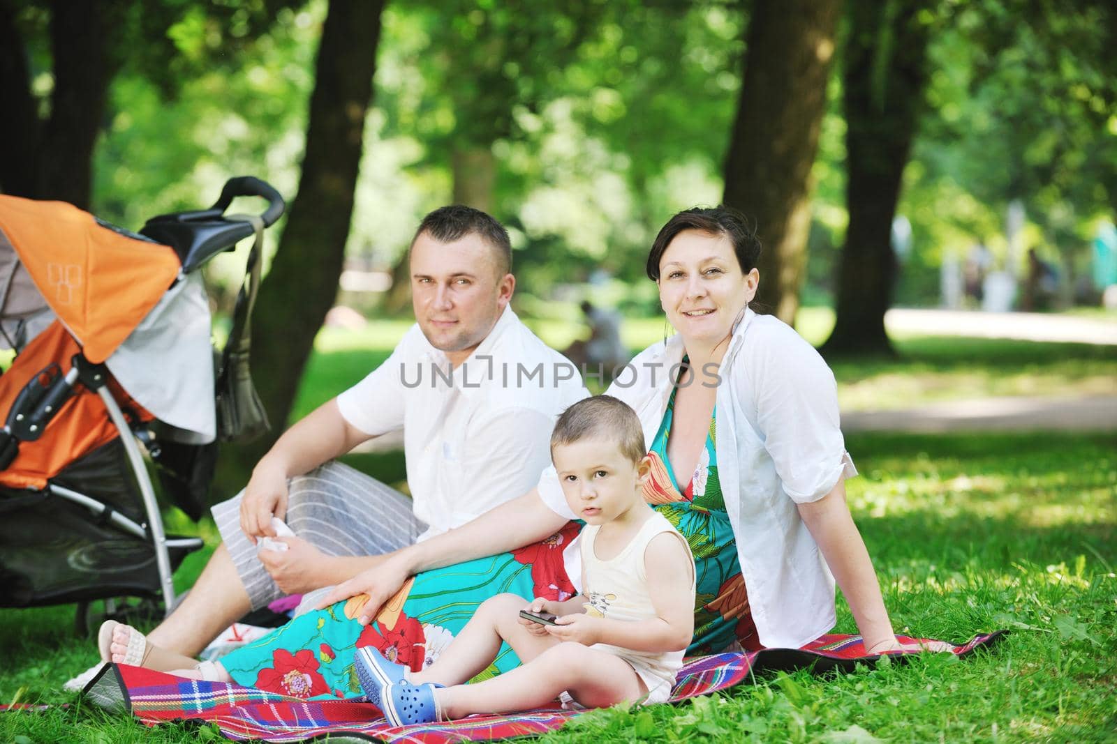 Family at park relaxing and have fun by dotshock