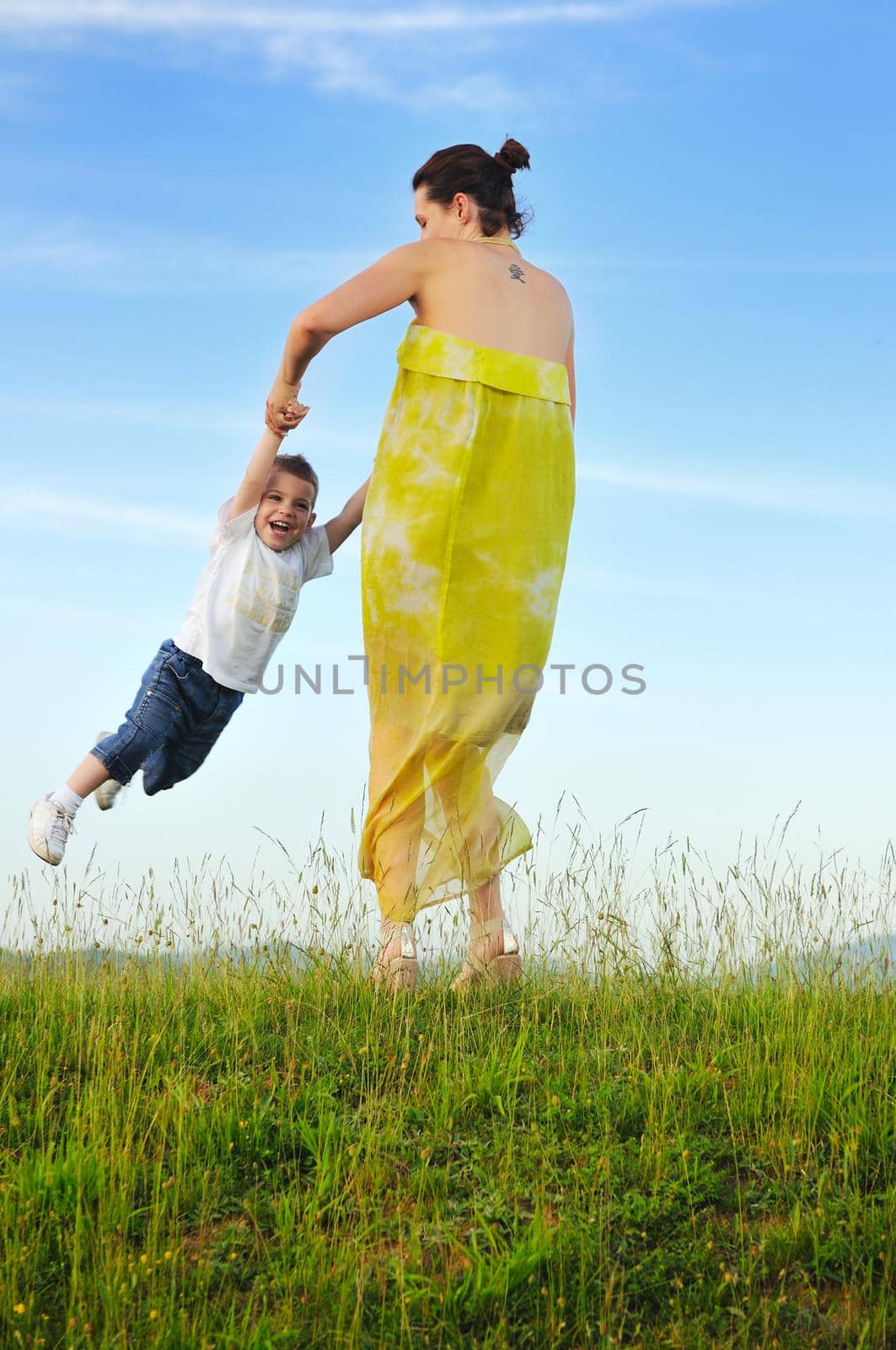 happy young woman mother play and outdoor with beautiful child