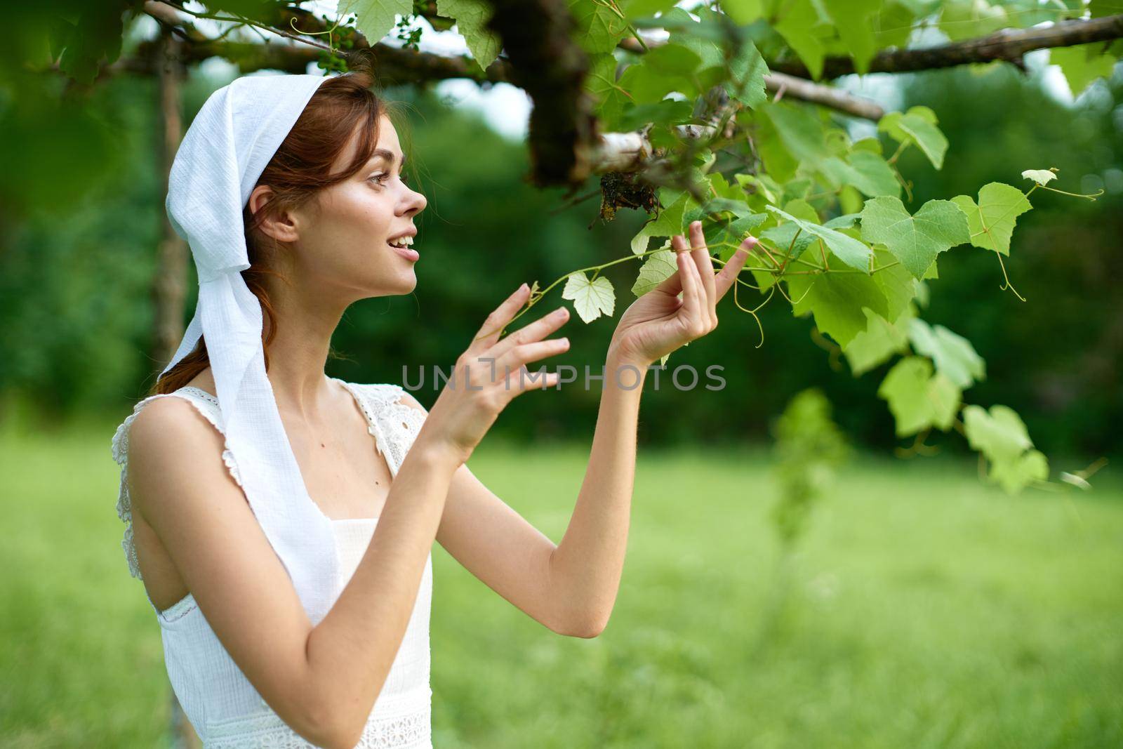 Woman in White Dress Countryside Household Care Nature Russian Tradition. High quality photo
