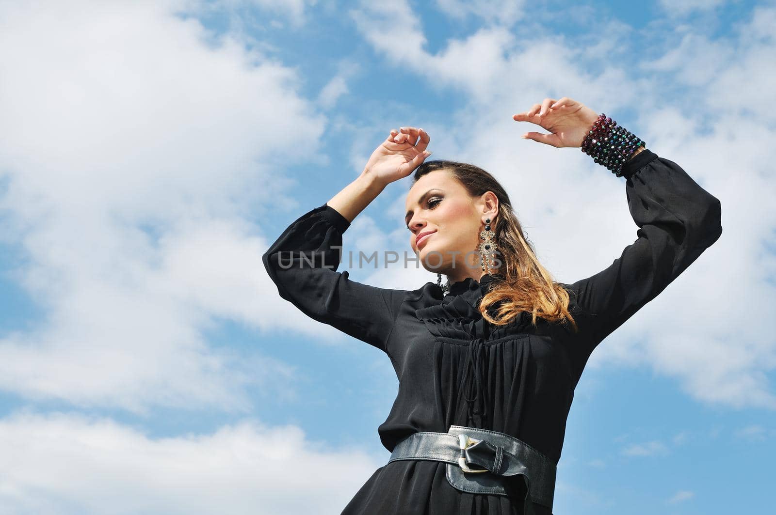 young woman posing in fashionable clothing outdoor