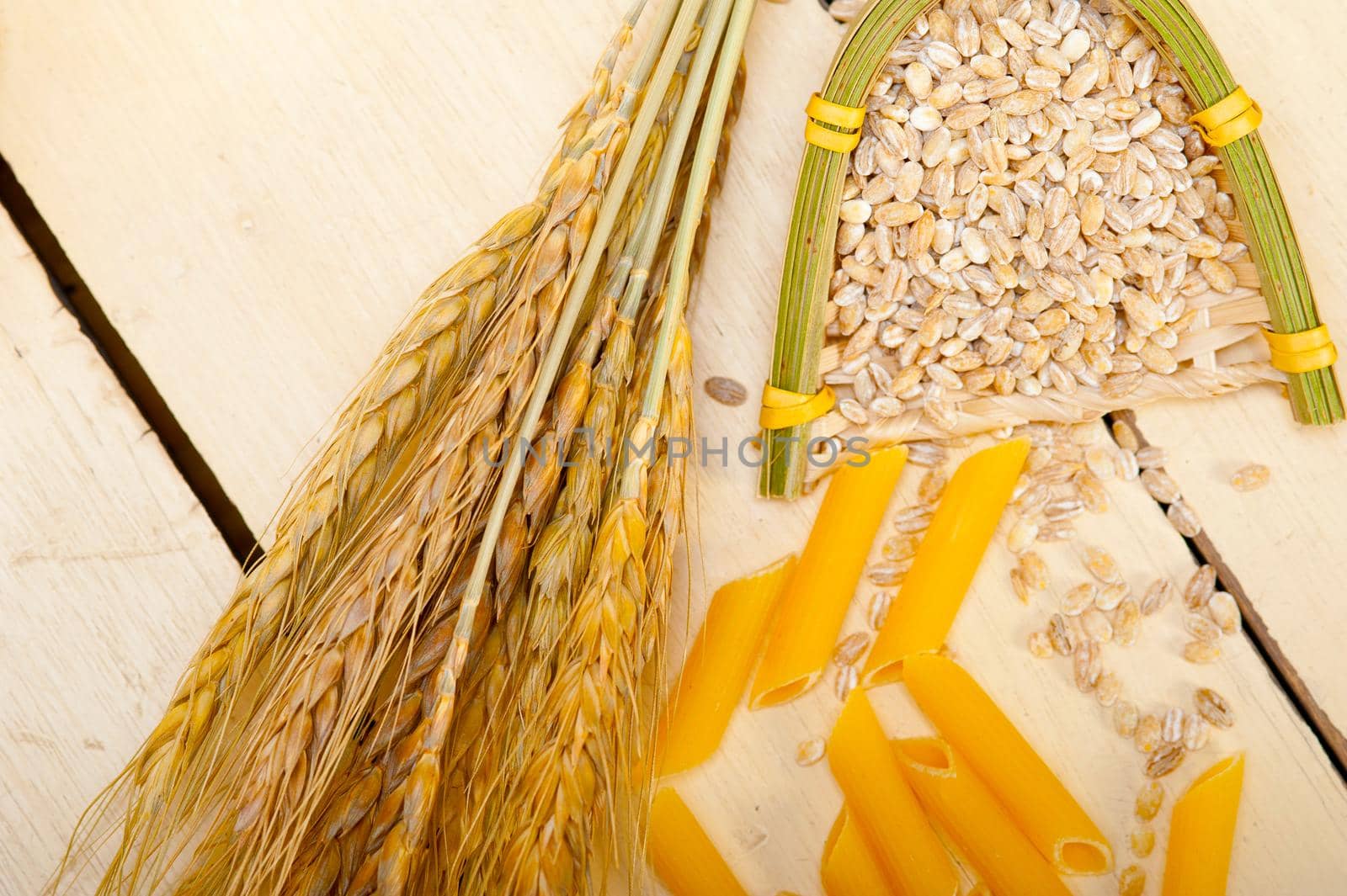 short Italian pasta penne with durum wheat grains