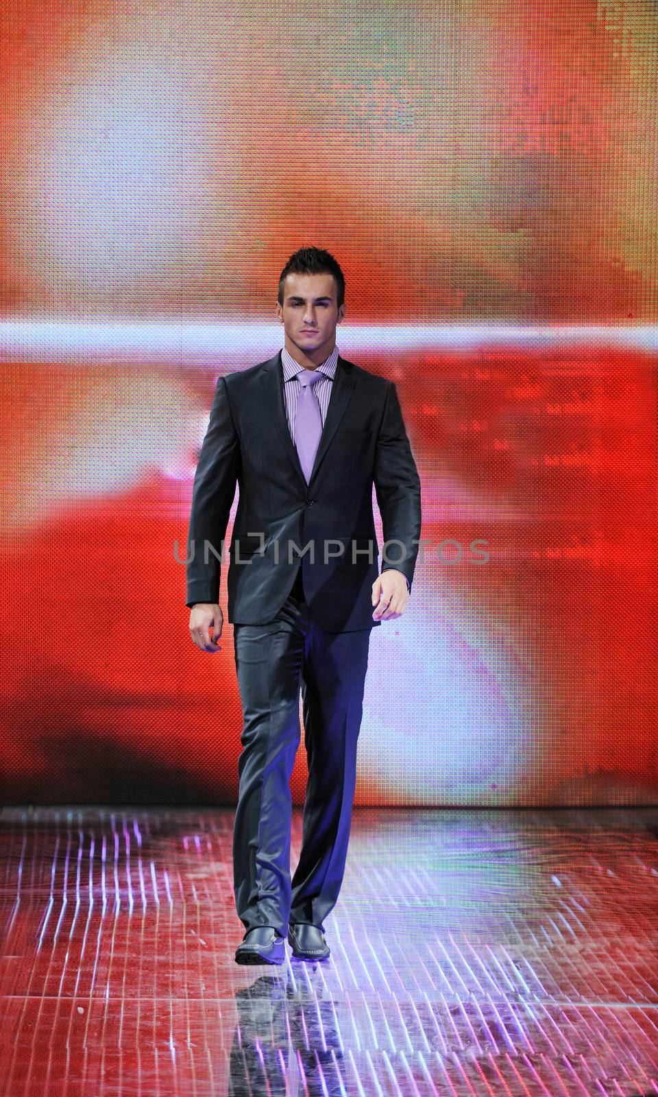 handsome man male model at fashion show stage event