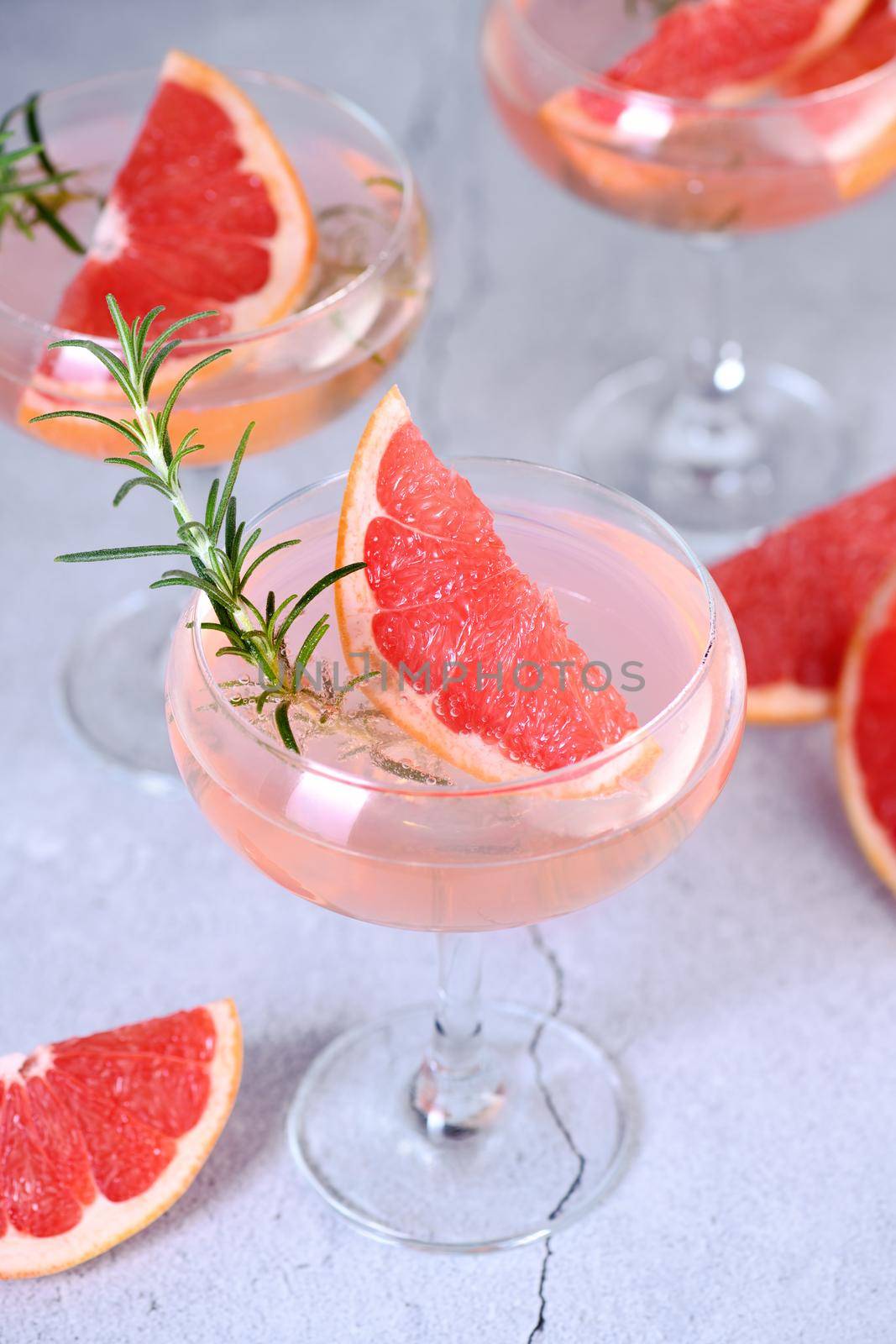 Сocktail Mimosa.  Grapefruit, rosemary and sparkling wine by Apolonia