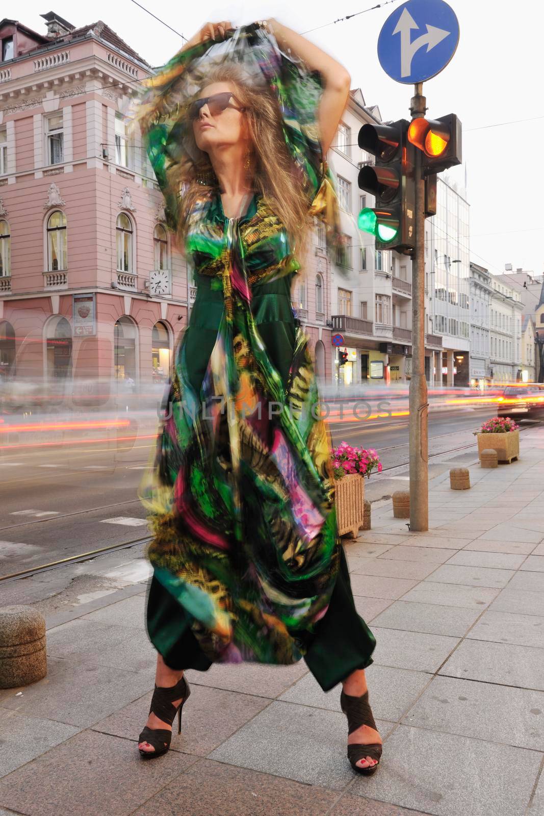 one beautiful young elegant woman in fashion and urban style dress in  city on  street at night alone