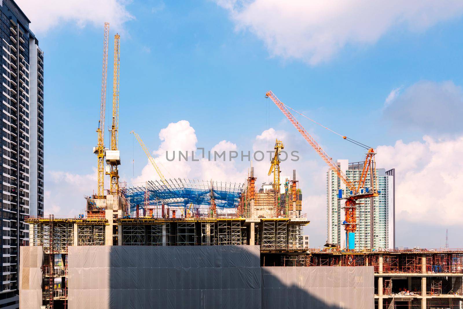 Construction site busy operate in beginning of building new complex infrastructure project. by Nuamfolio