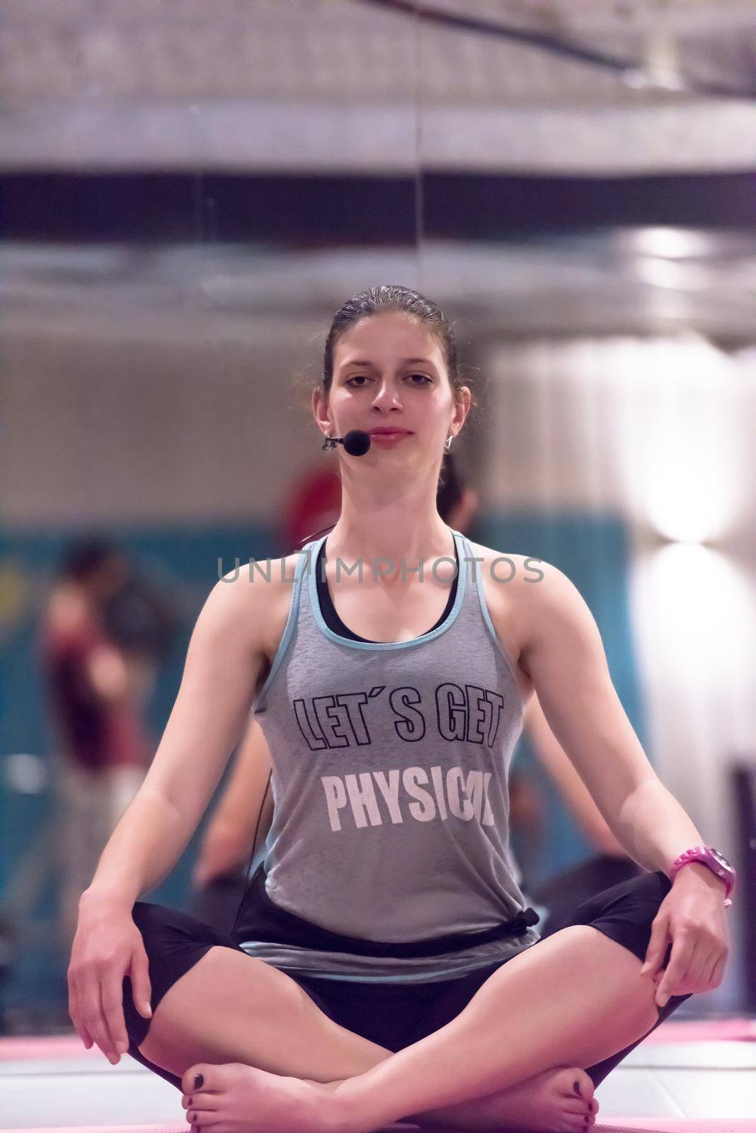 sportswoman doing yoga exercise and meditating by dotshock