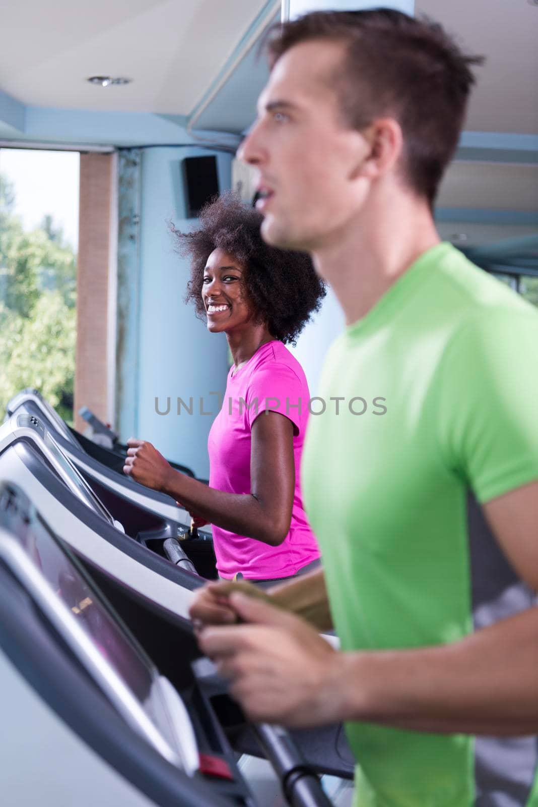 people exercisinng a cardio on treadmill by dotshock