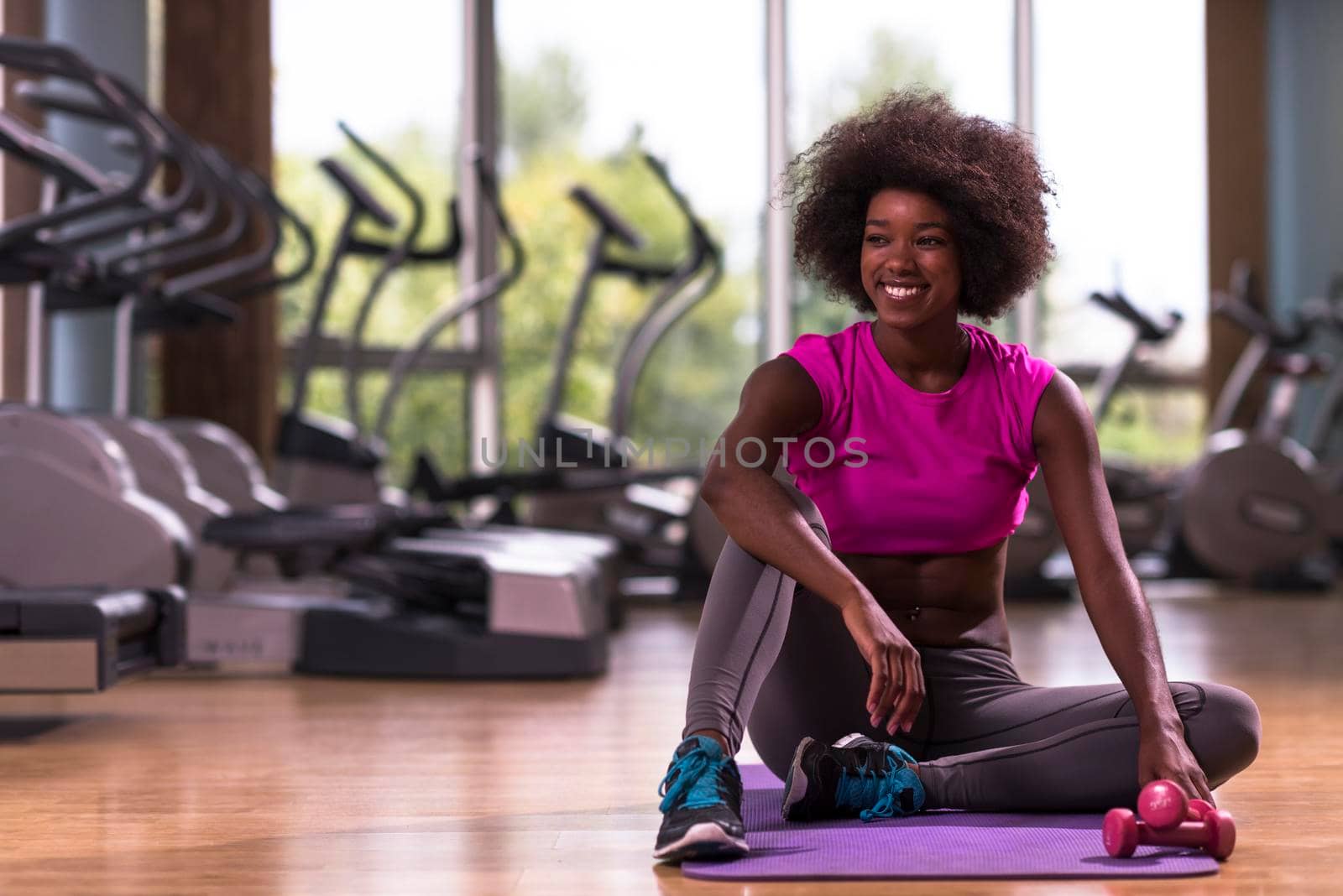 beautiful young african american woman exercise yoga in gym