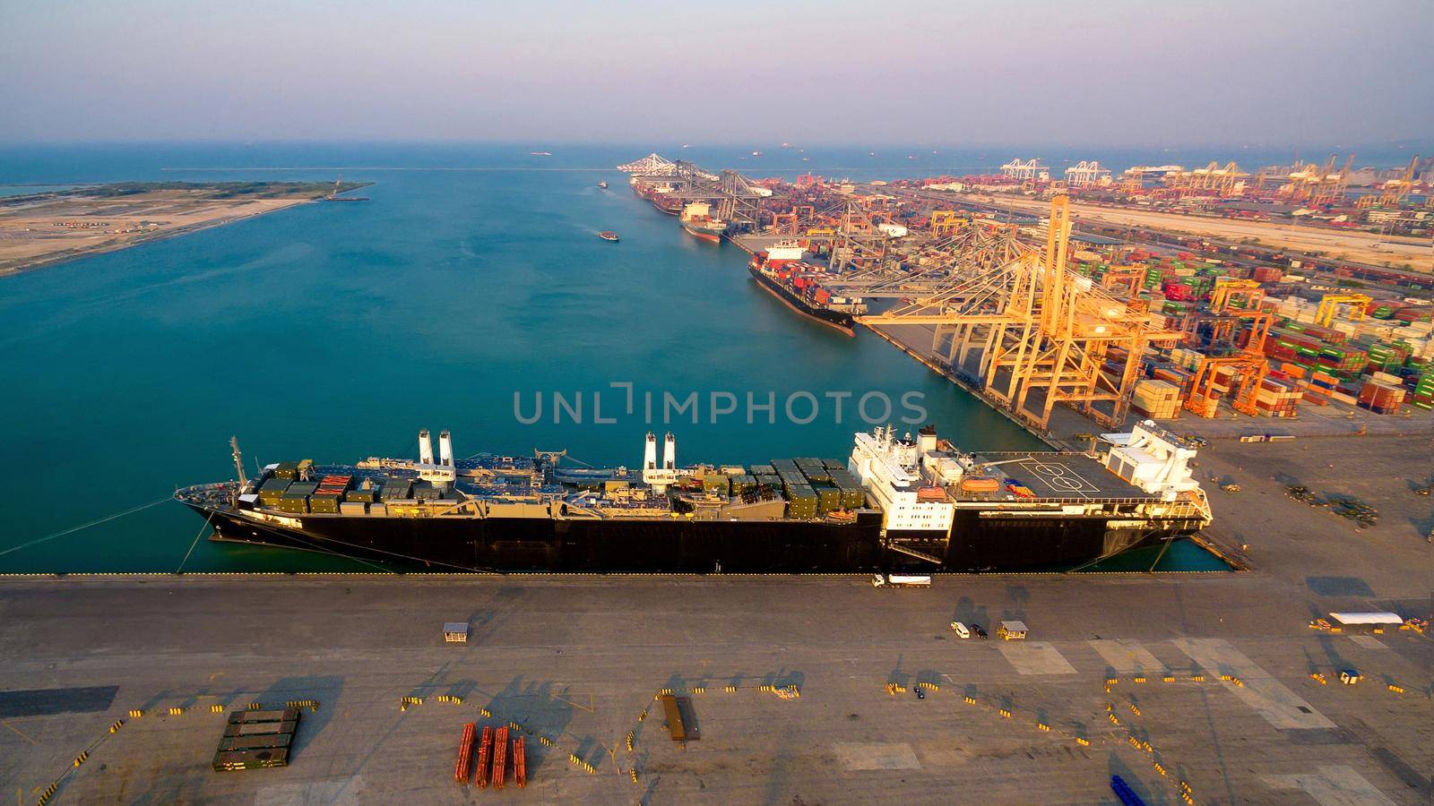 Logistic container ship at shipping yard main transportation of cargo container shipping. by Nuamfolio