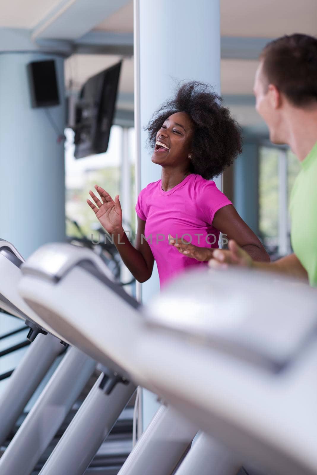 people exercisinng a cardio on treadmill by dotshock