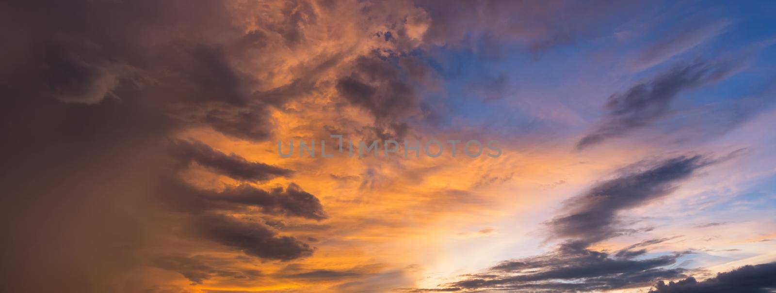 Panorama view of dramatic beautiful nature sunset sky and clouds background by Nuamfolio