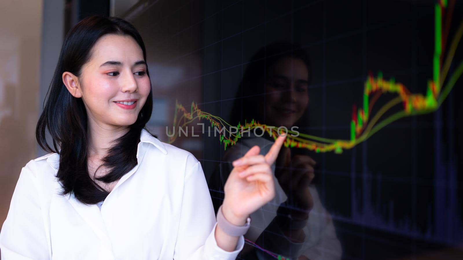 Businesswoman pointing chart financial market trader. Concept of stock market, cryptocurrency.