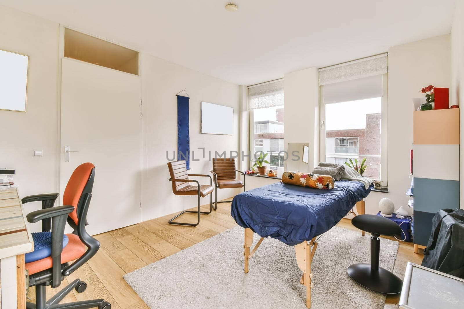 Lovely room with massage table and large windows