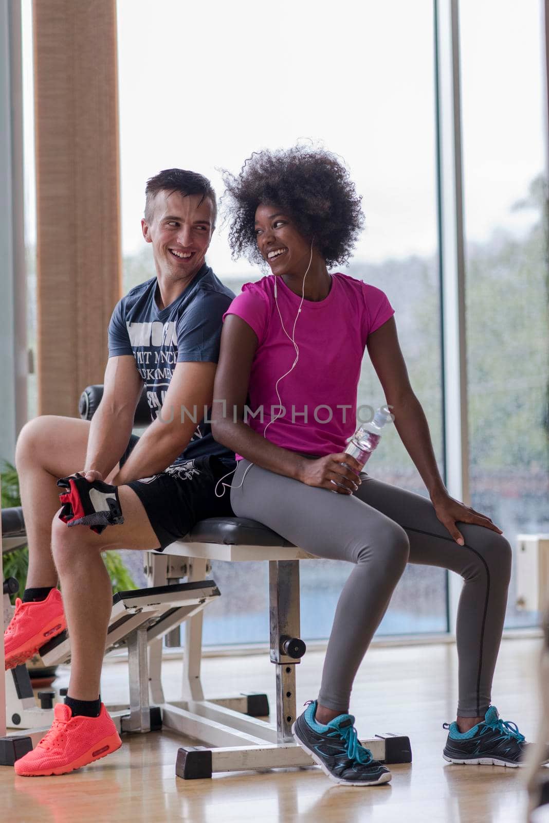 couple in a gym have break by dotshock