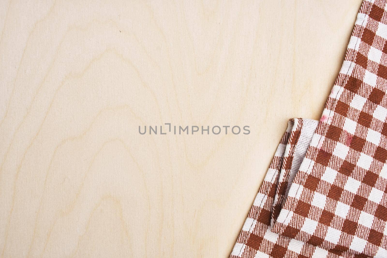 checkered tablecloth light wooden table kitchen interior. High quality photo